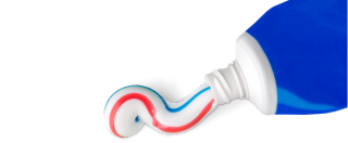 Toothpaste being squeezed from a blue tube